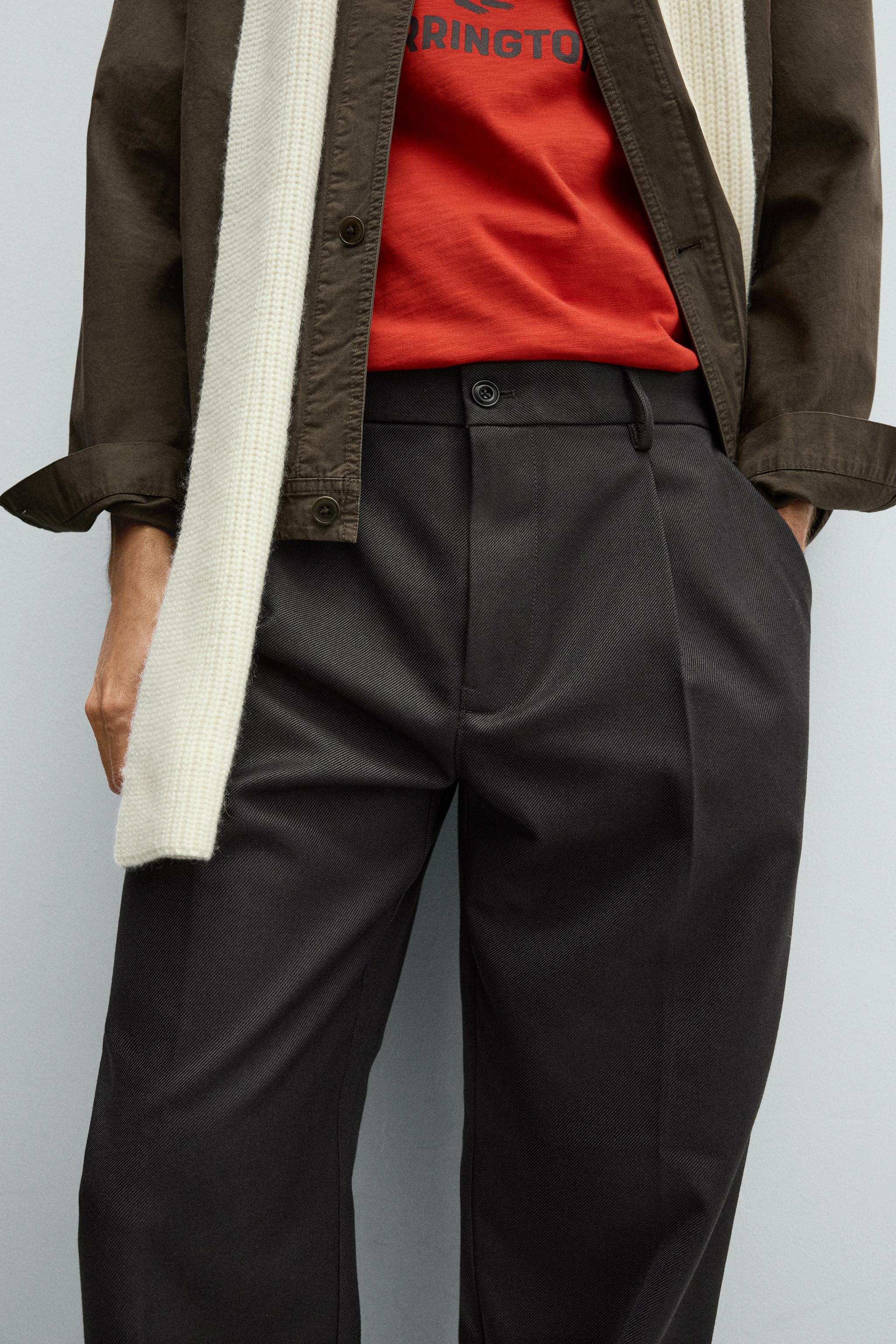 TEXTURED PLEATED PANTS